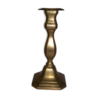 Old candle holder in golden brass