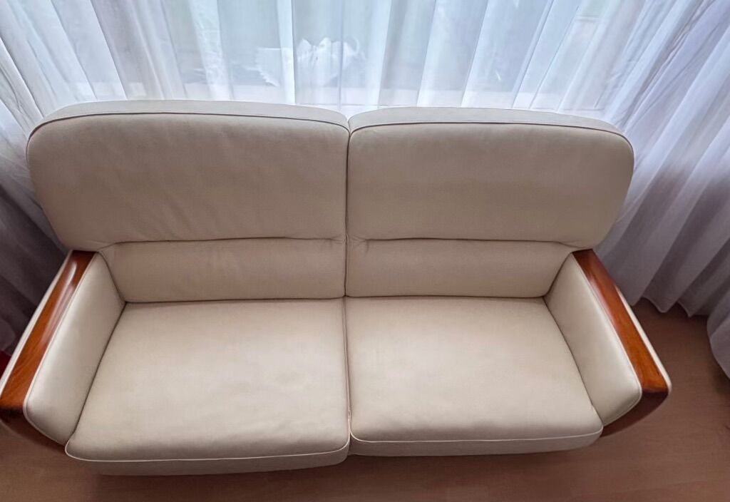 Beige leather sofa with solid wood frame