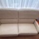 Beige leather sofa with solid wood frame