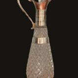 Diamond-point molded glass ewer, silver-plated metal.