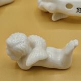 12 porte-couteaux vintage en porcelaine figurant des chérubins