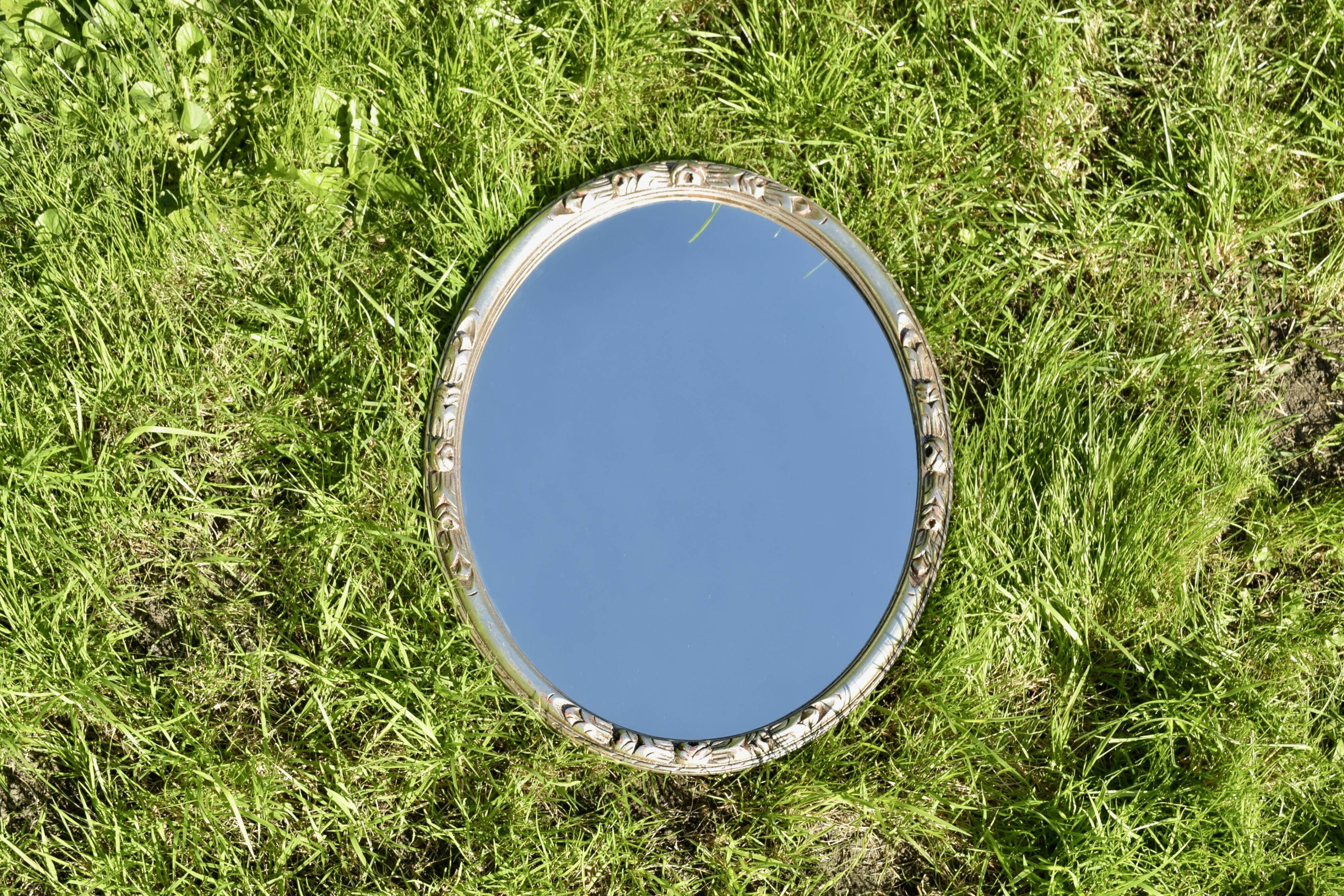 Old large oval wall mirror in silver painted wood - 1950s