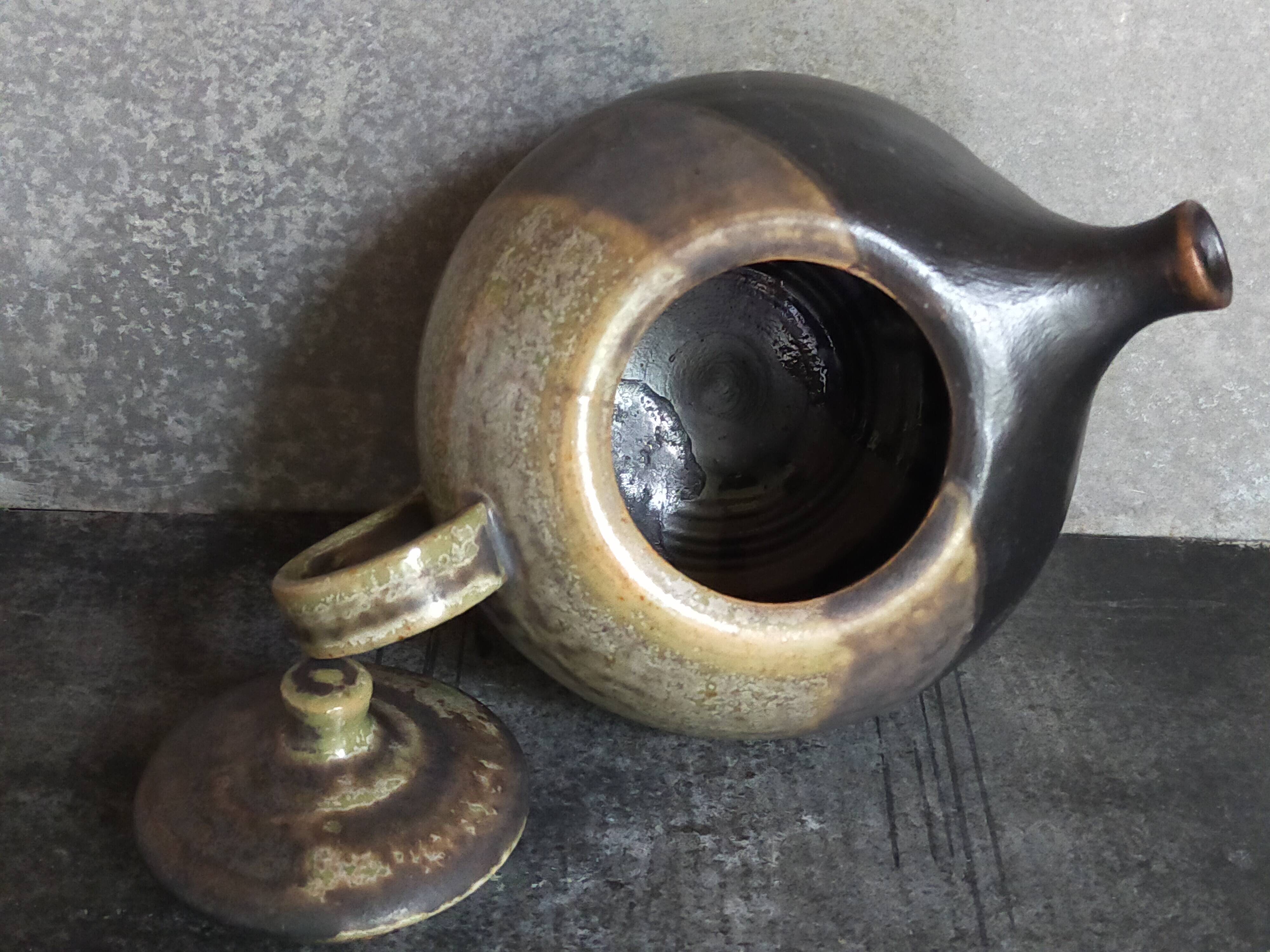 Vintage enameled stoneware potter's teapot