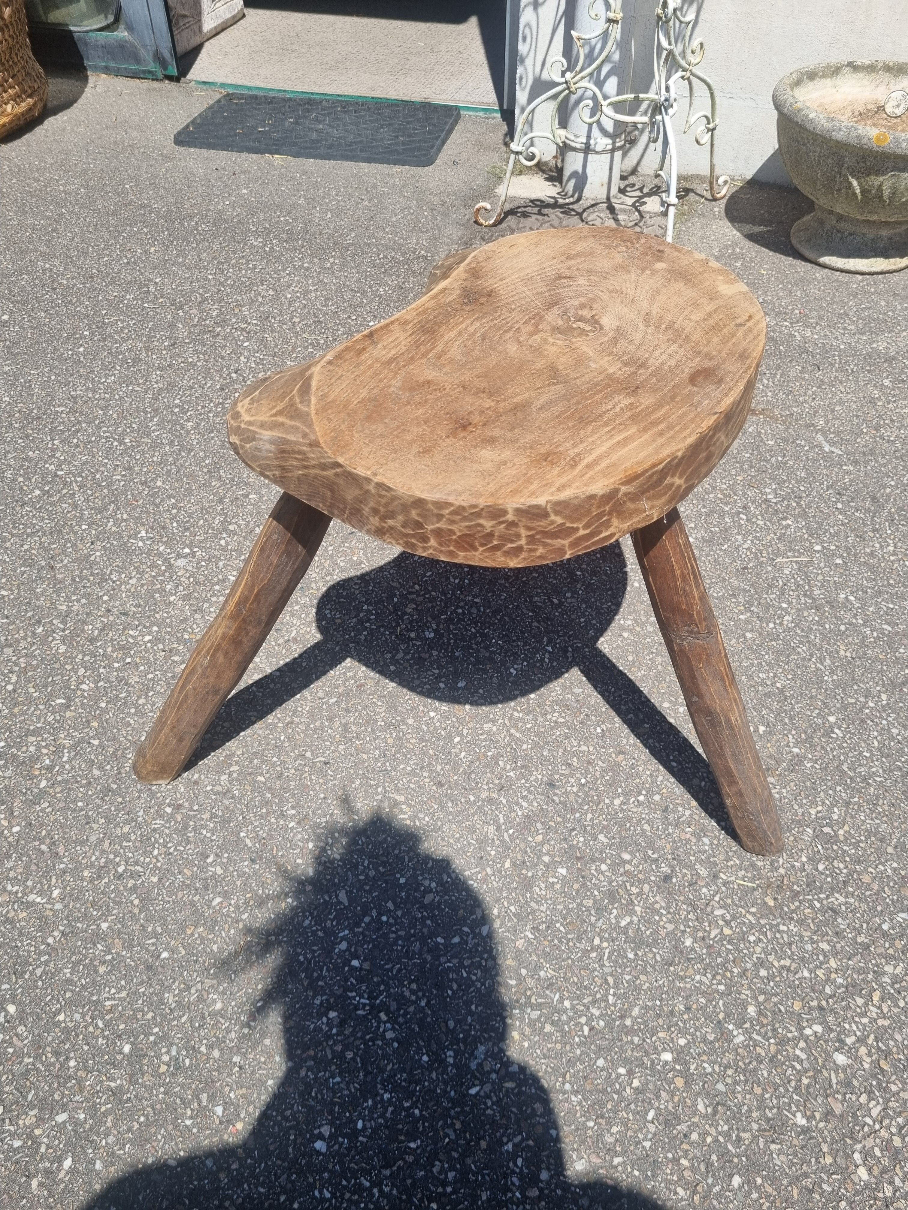 Old wooden tripod stool