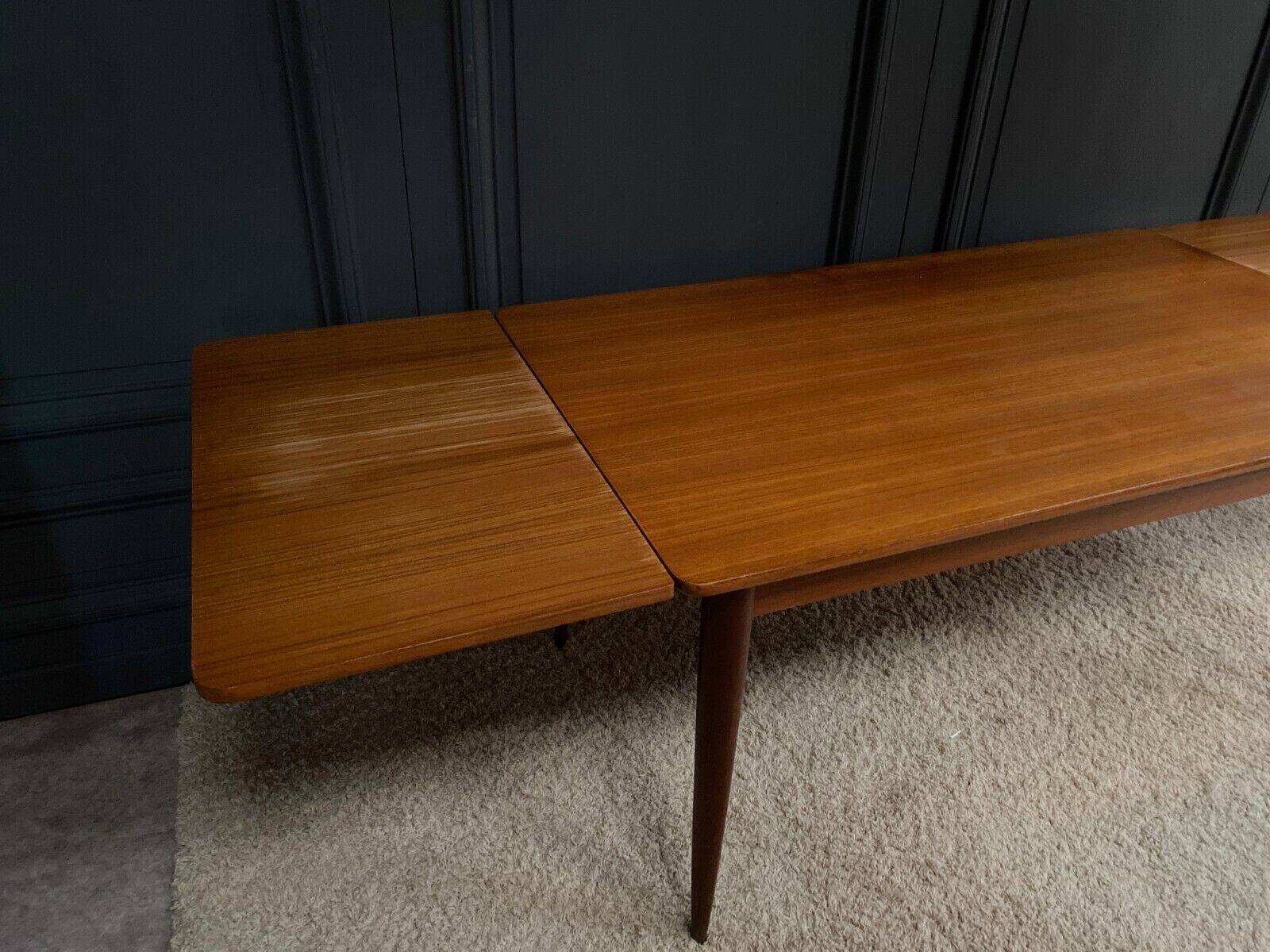 Scandinavian rectangular teak dining table with 4 tapered legs