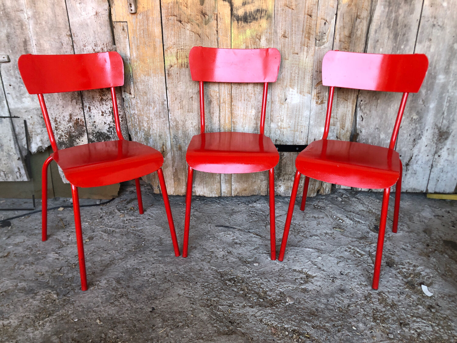 Set of 4 red metal chairs