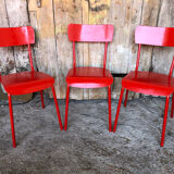 Set of 4 red metal chairs