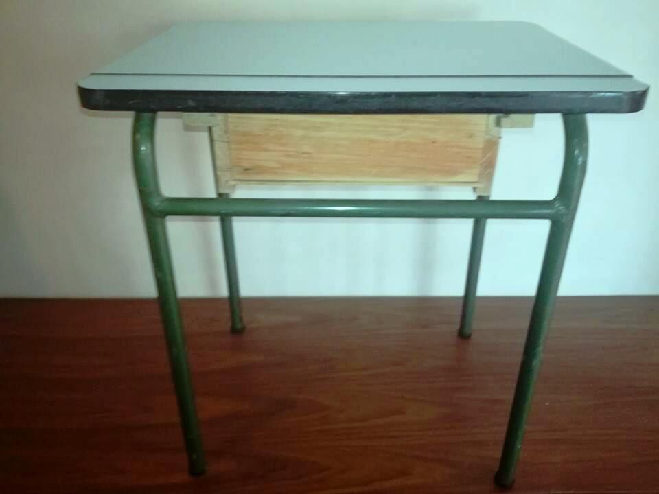 Child in formica desk