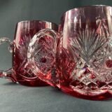Pair of cut and red tinted crystal beer mugs signed Etzel