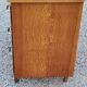 Vintage chest of drawers in golden oak from the 50s with 3 drawers and spindle-legged shelf