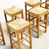 set of seven rattan and wood barstools