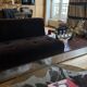 Red Edition Stanley 3-seater sofa with matching chocolate velvet storage.