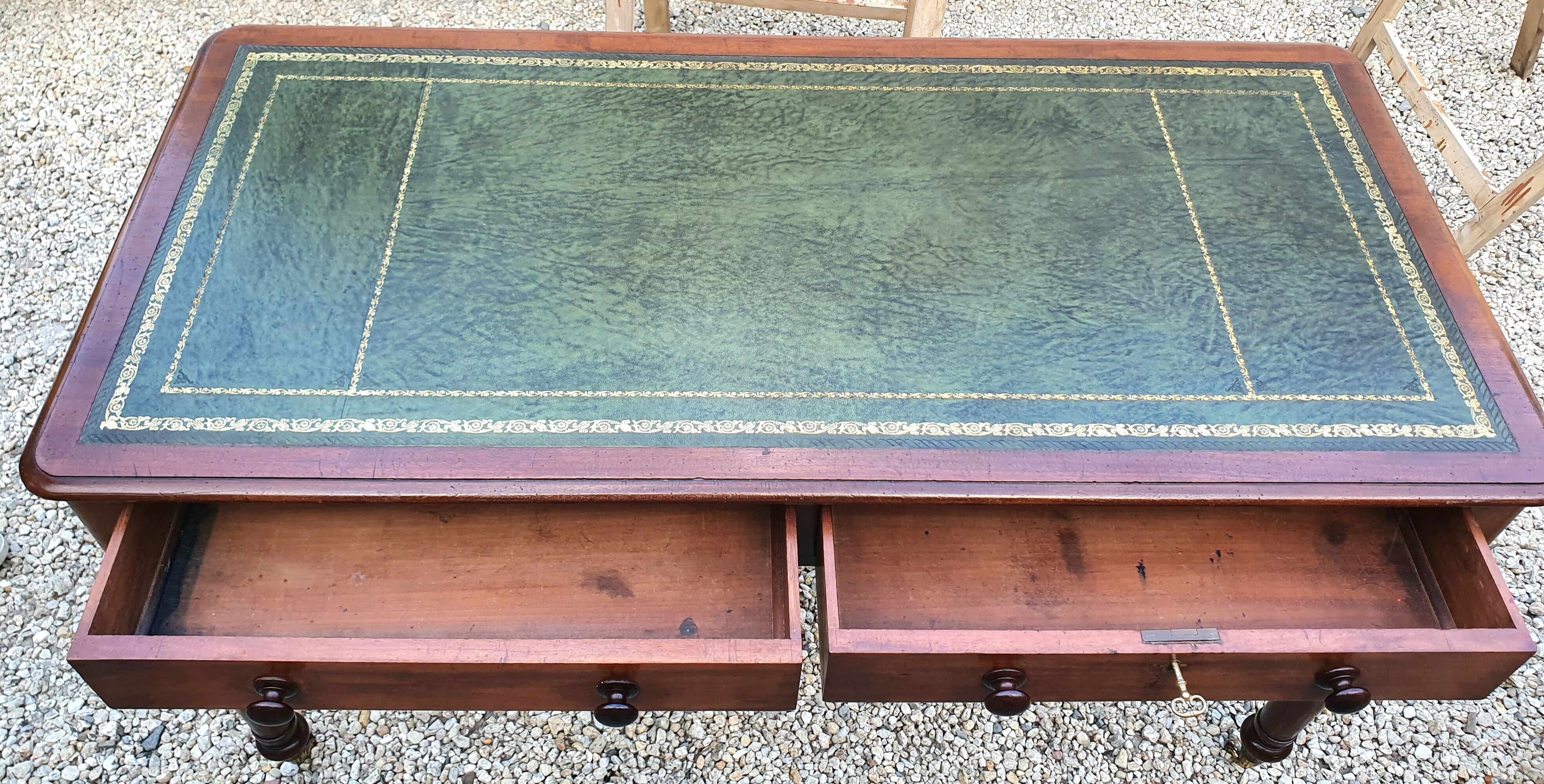 English desk with 2 drawers on green leather