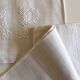 pair of AP monogram towels in cold linen
