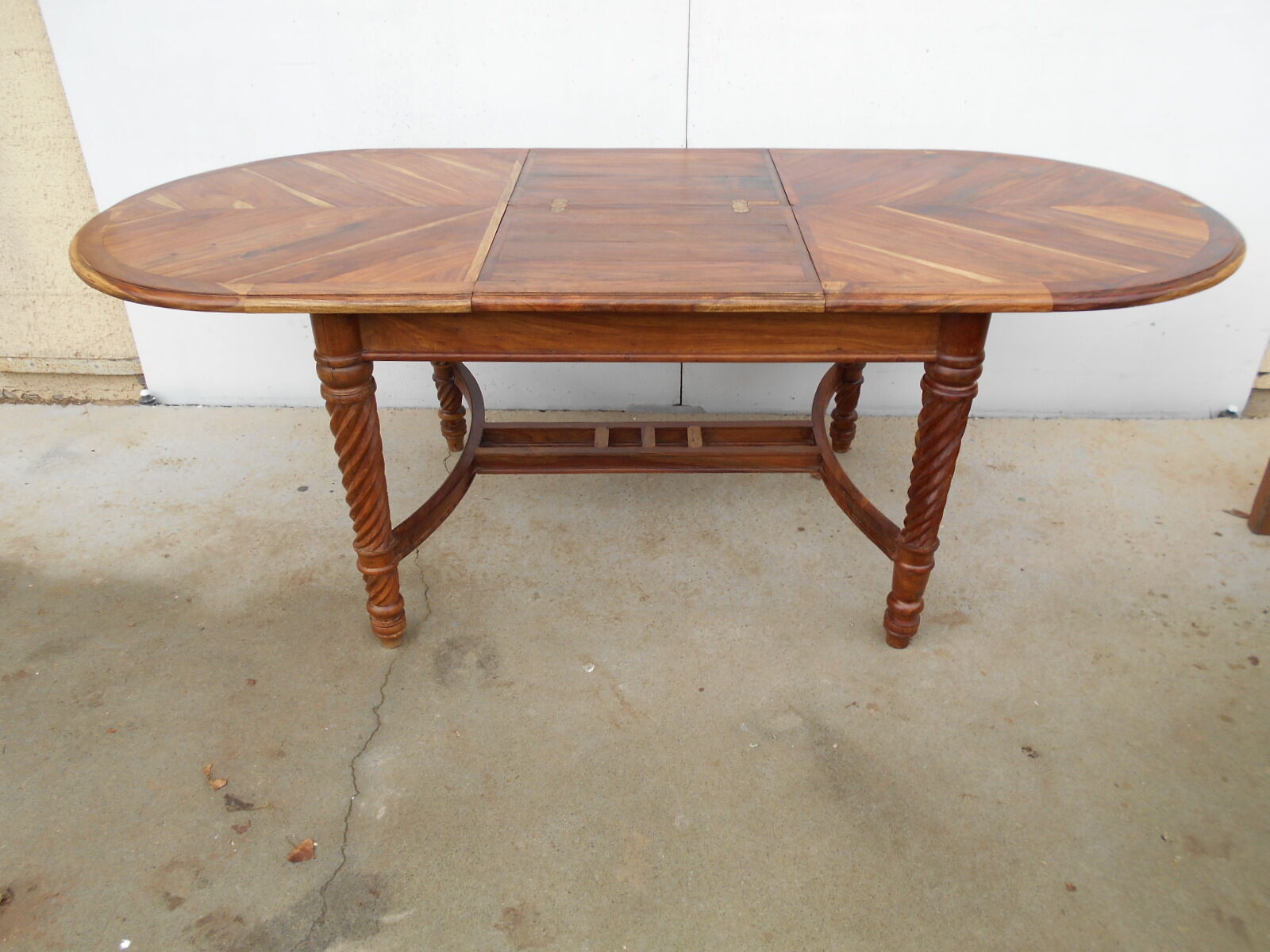 Oval table, integrated extension, in exotic wood