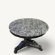Empire dining table in blackened wood and grey marble, 19th century.