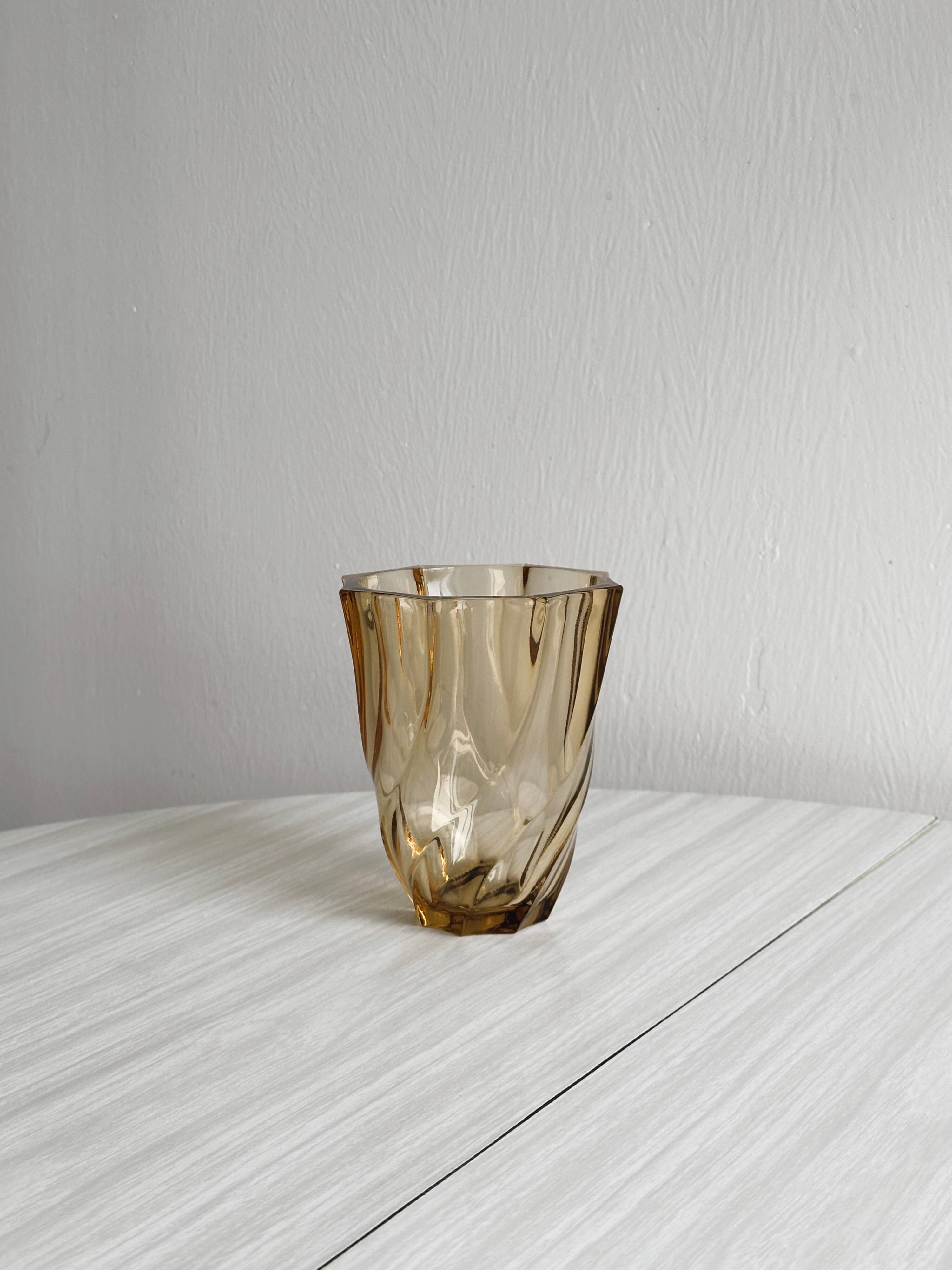 Small translucent pink twisted glass vase