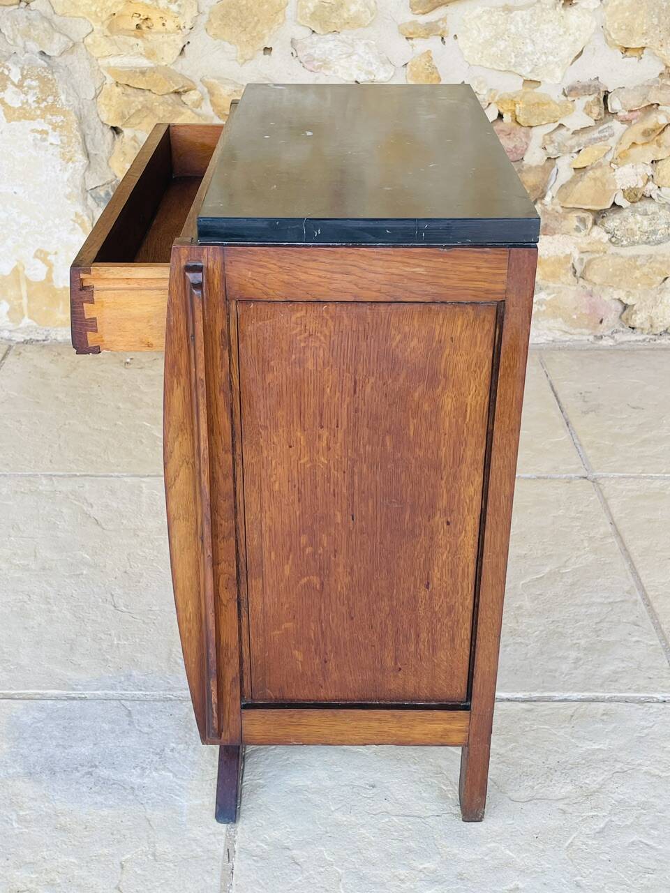 Art Deco bedside table in walnut, black marble top, circa 1920.