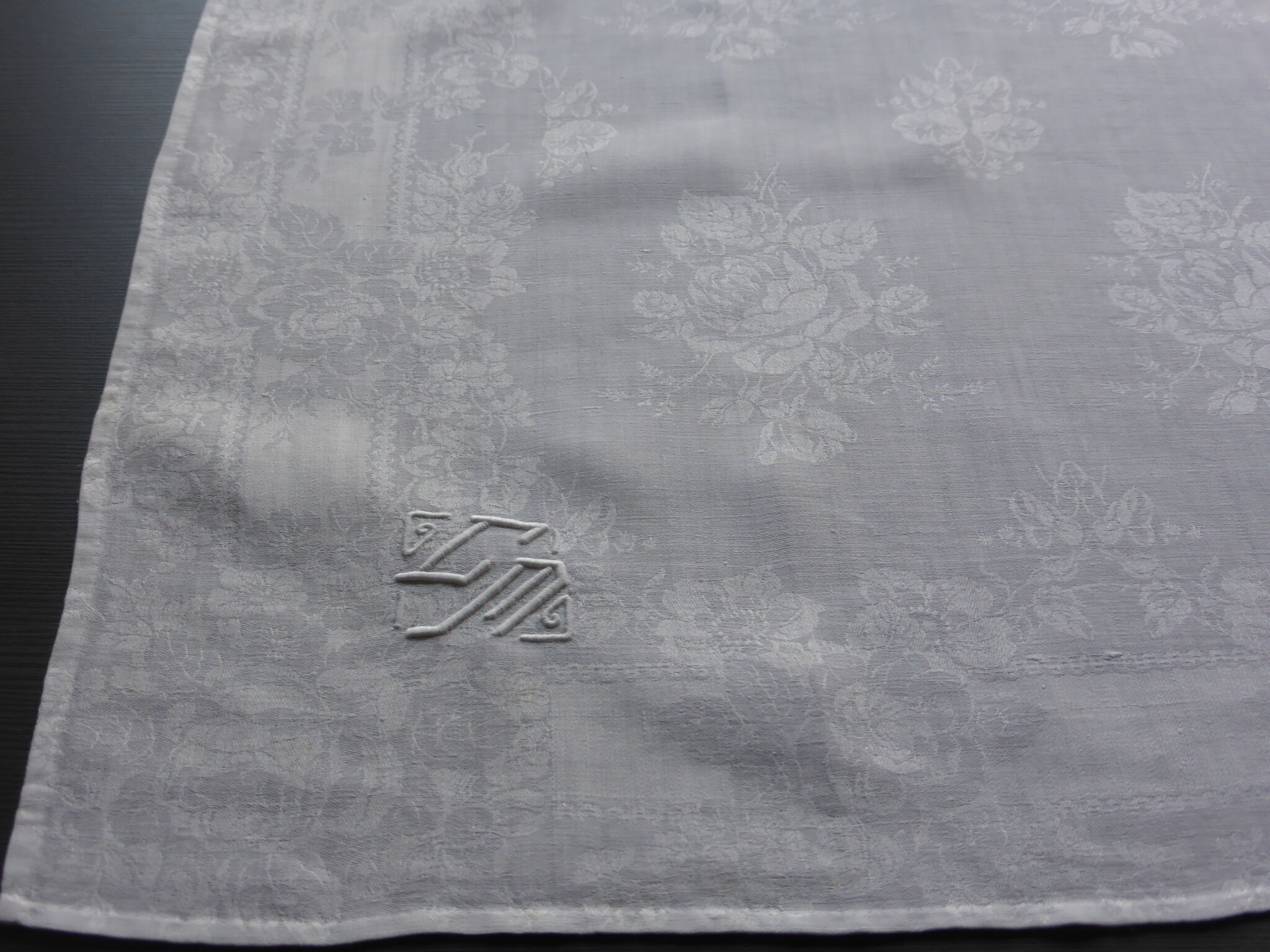 12 antique damask towels decorated with roses and embroidered with CM monogram