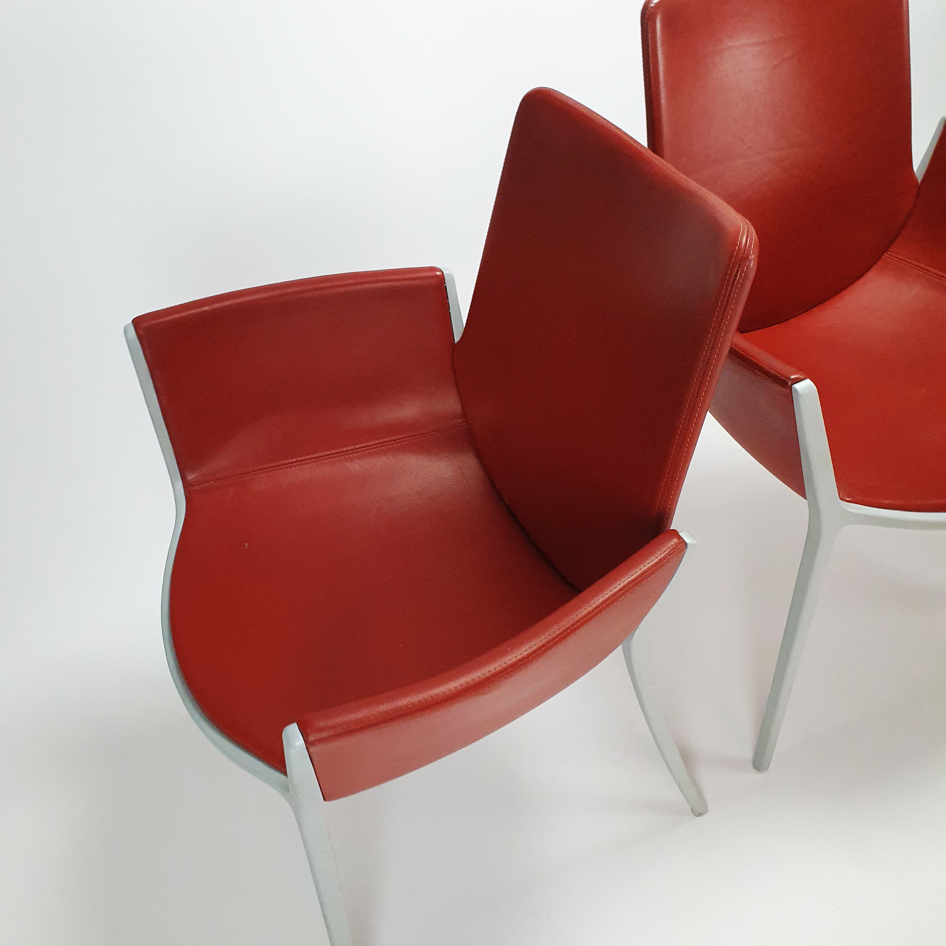 Set of 4 red leather and aluminium duna chairs by Jorge Pensi for Cassina, 1990s