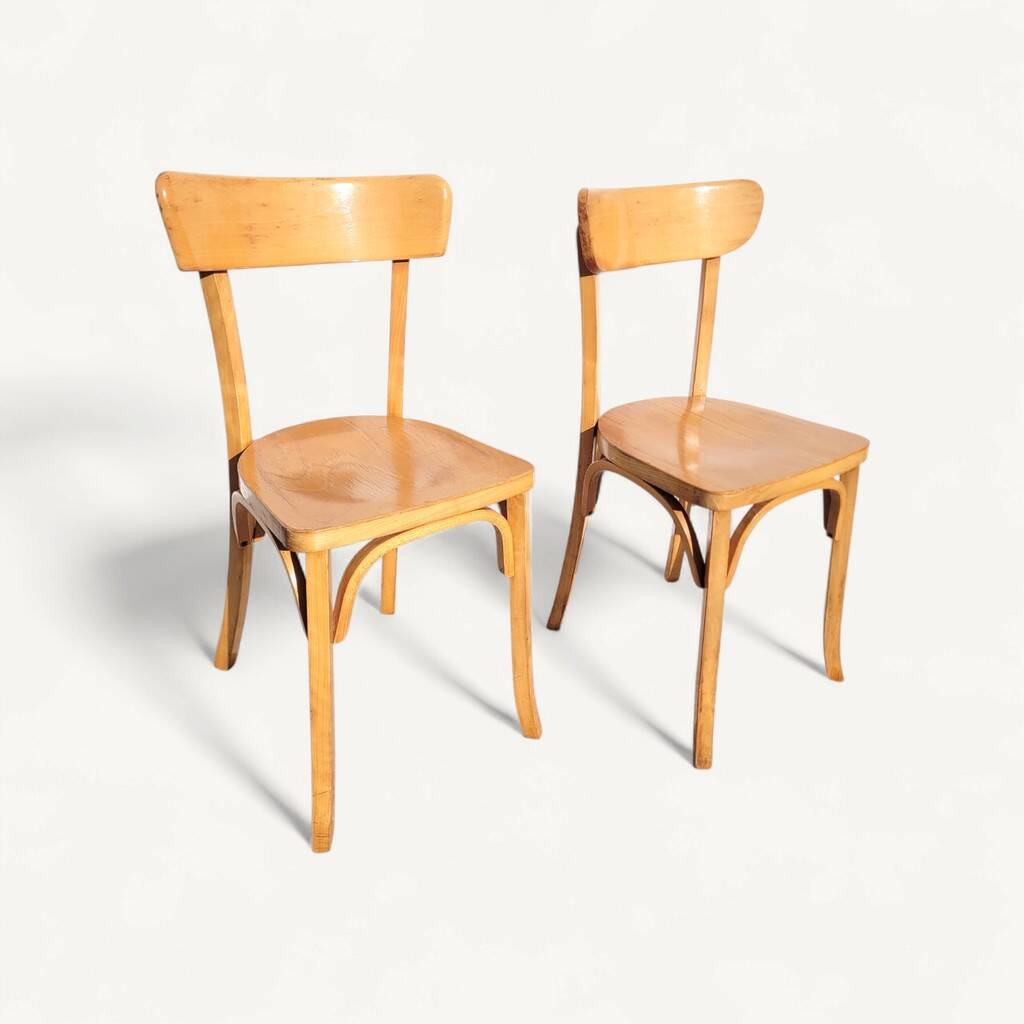 Pair of vintage bistro chairs in golden oak.