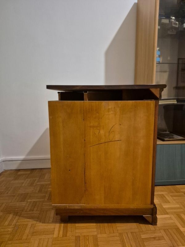 Wooden TV unit with a rotating top.