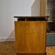 Wooden TV unit with a rotating top.