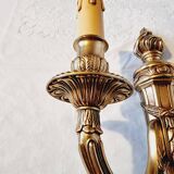 Pair of Louis XV style rocaille two-armed sconces in gilded bronze