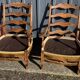 pair of rustic wood and fabric armchairs