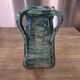 Vintage brutalist ceramic vase with 4 green handles.
