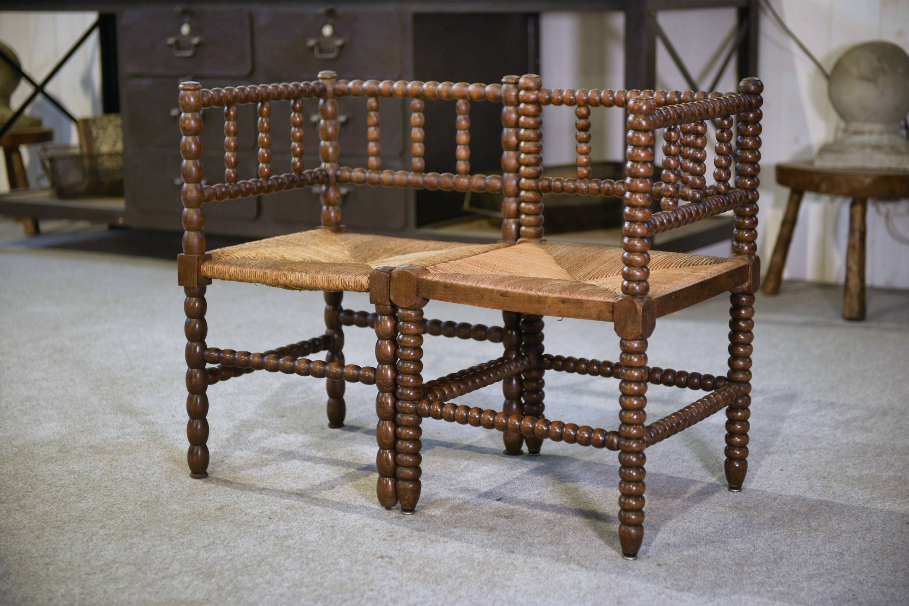 Pair of turned wooden corner chairs from the 1950s.
