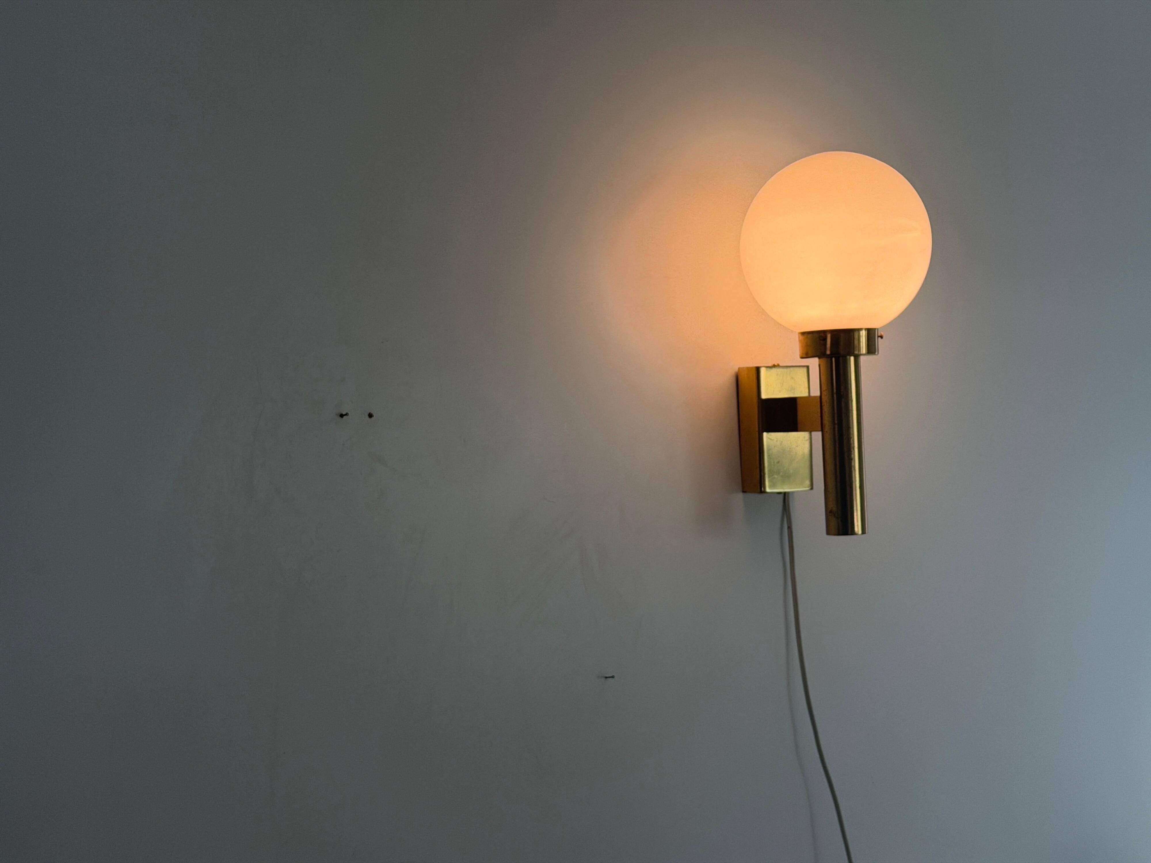 Large minimalist cinema wall light in opal glass and heavy brass, 1960s, Germany