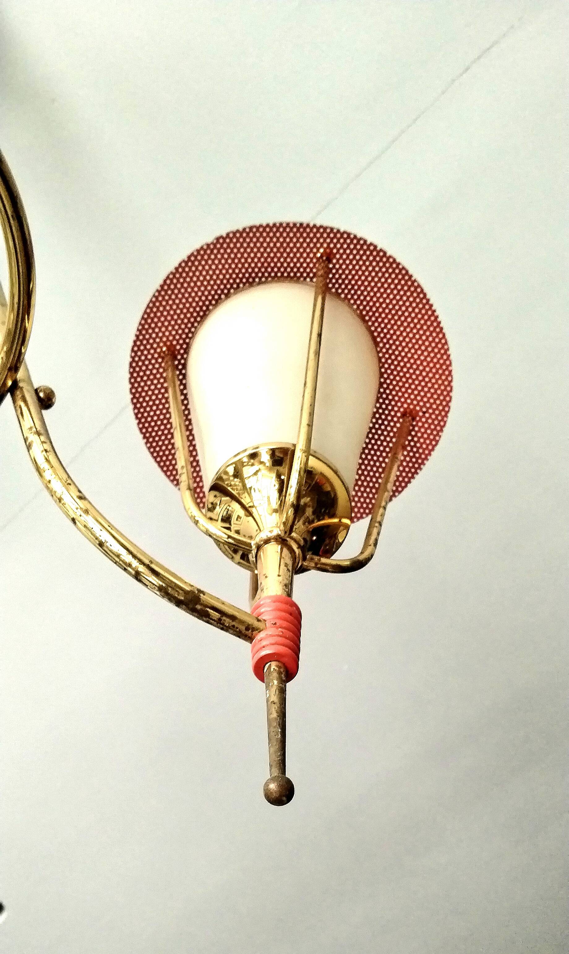 Three-arm pendant light in gilded brass and perforated metal by Maison Arlus Vintage from the 50s