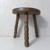 Old milking bench tripod stool in solid wood