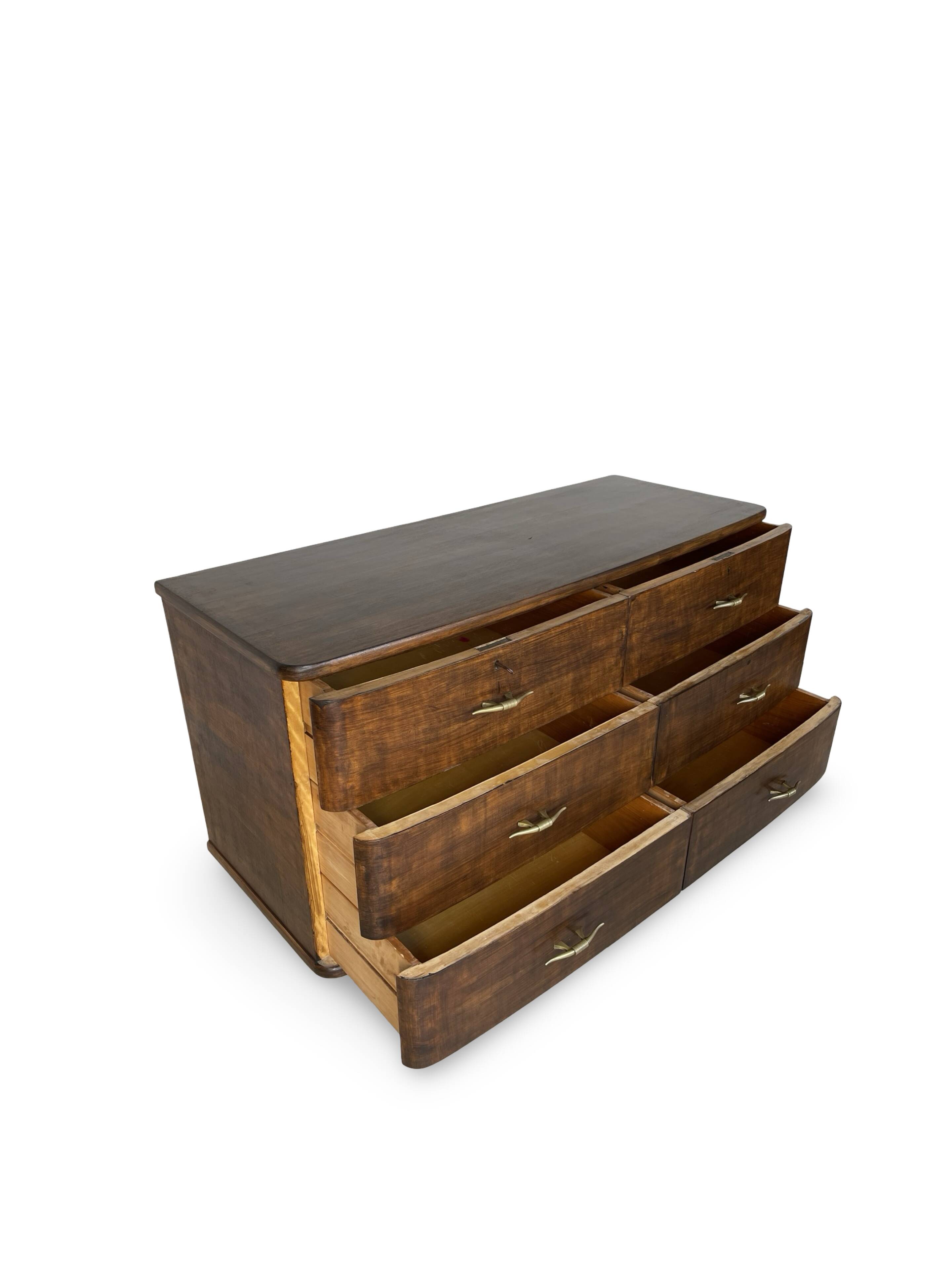 A vintage Italian chest of drawers, made of veneered walnut and solid wood,