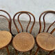 Set of 10 bentwood bistro chairs with cane seat.
