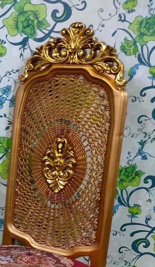 Pair of gilded chairs with Louis XV style floral pattern