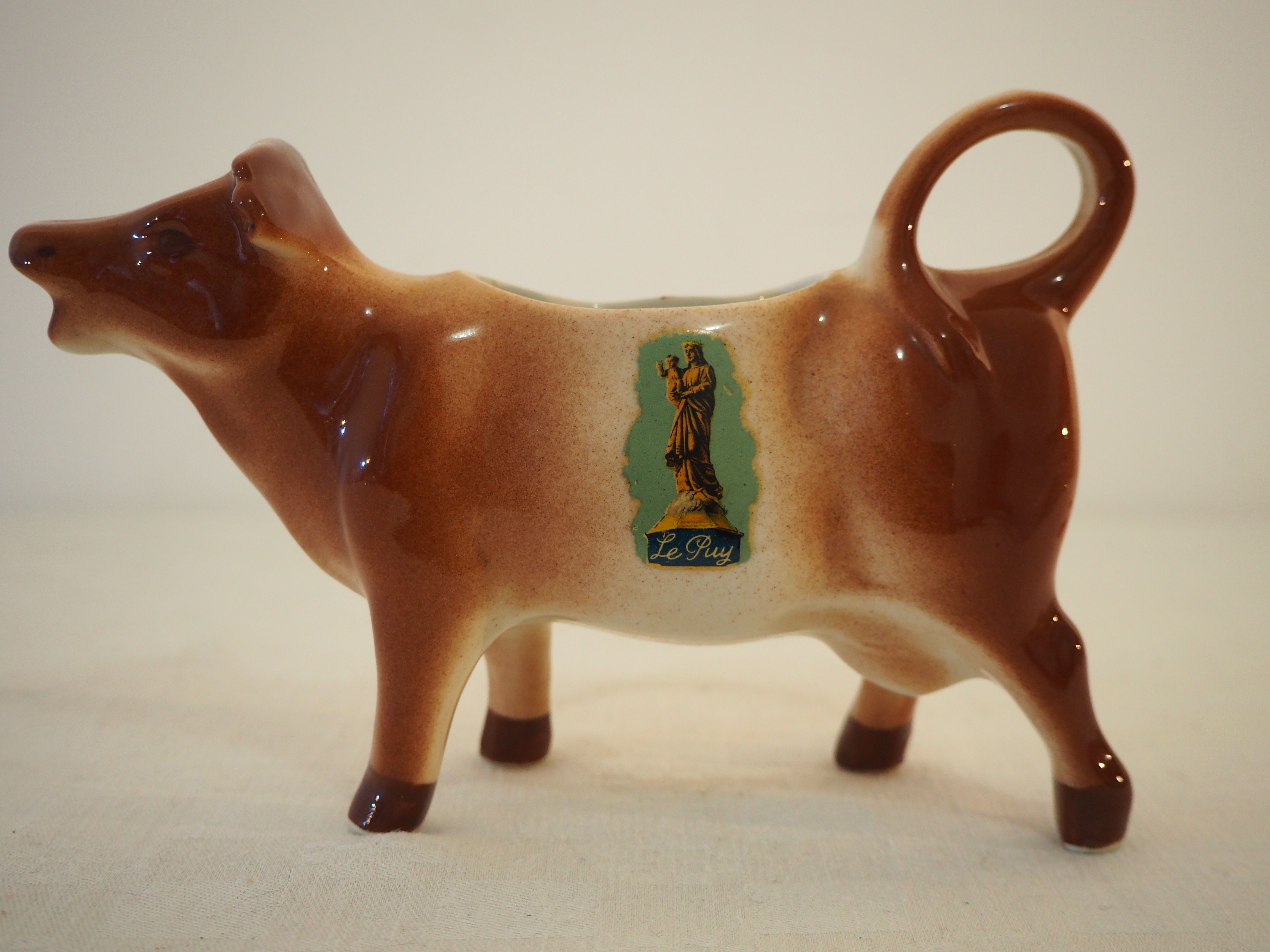 Milk jar in the shape of a vintage ceramic cow