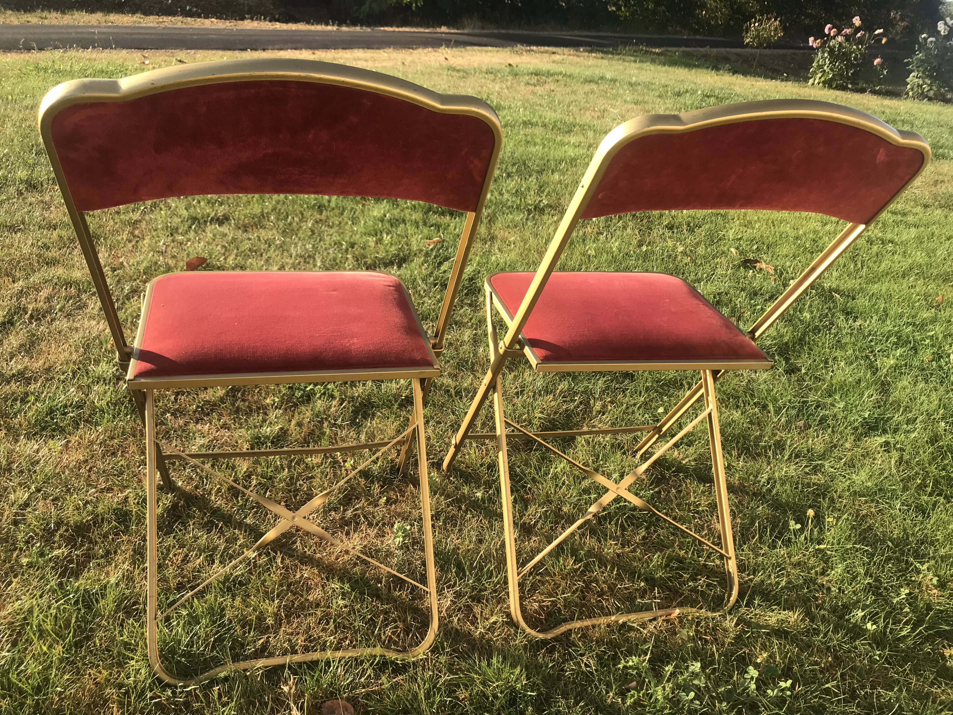 Pair of foldable red velvet chairs