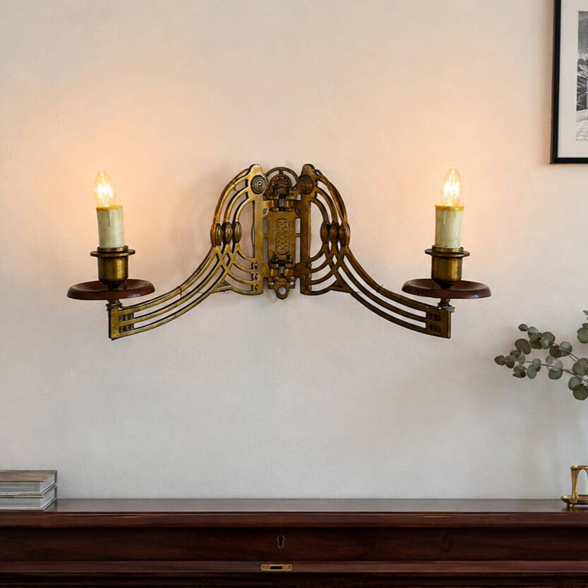 Art Nouveau style brass double piano wall lamp