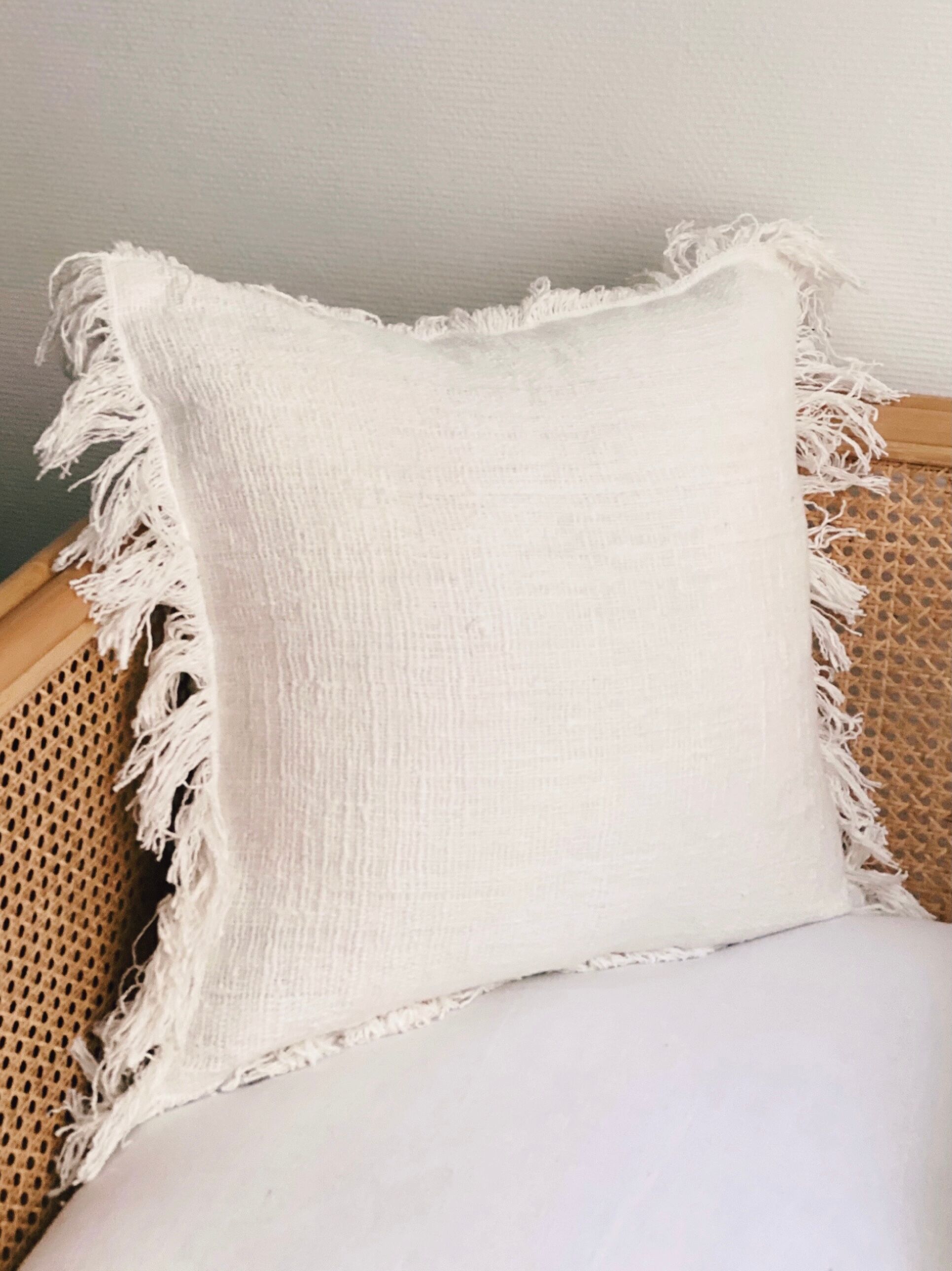White linen bohemian cushion fringed