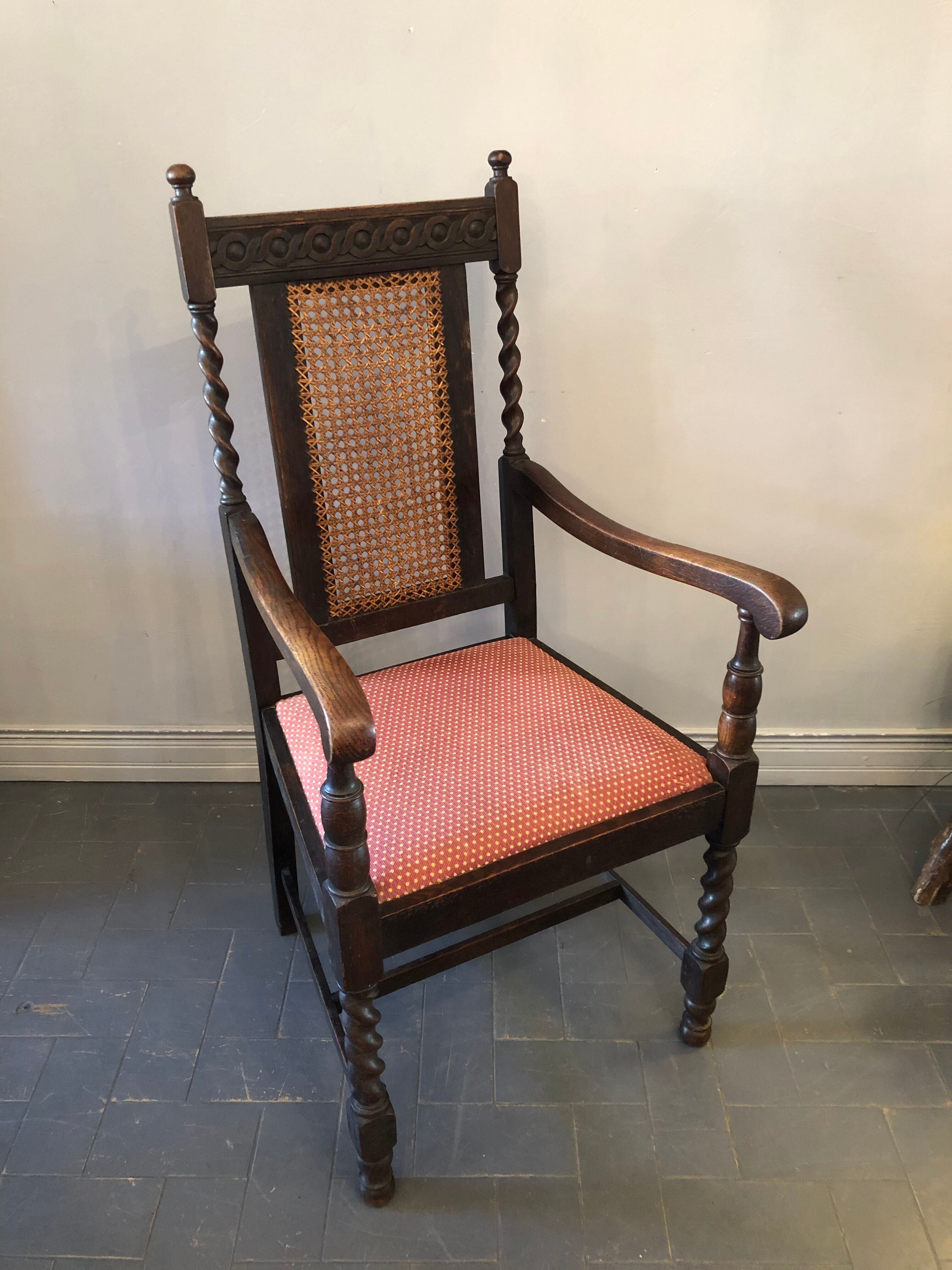 Carved wooden armchair and cannage