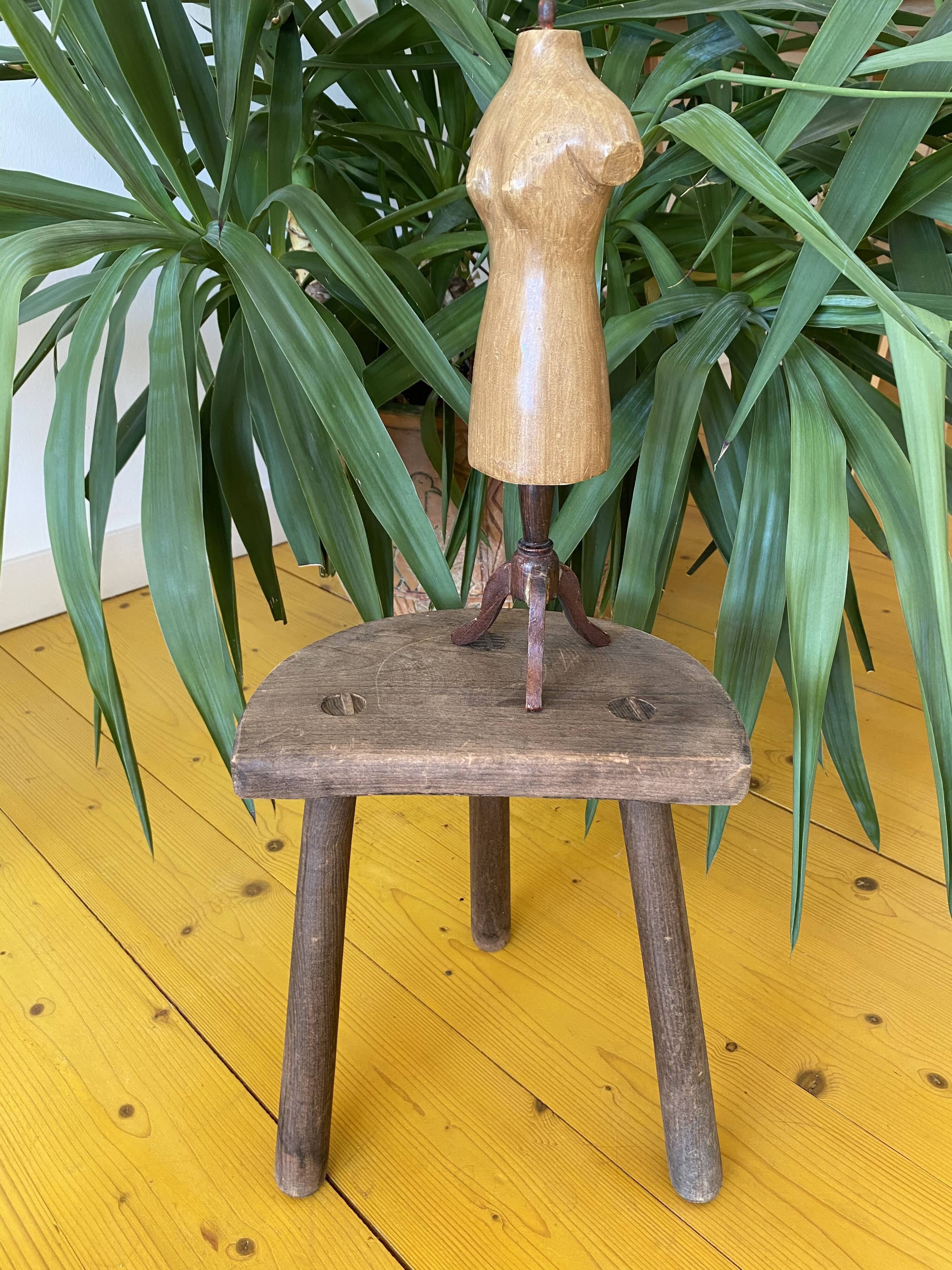Old wooden tripod stool