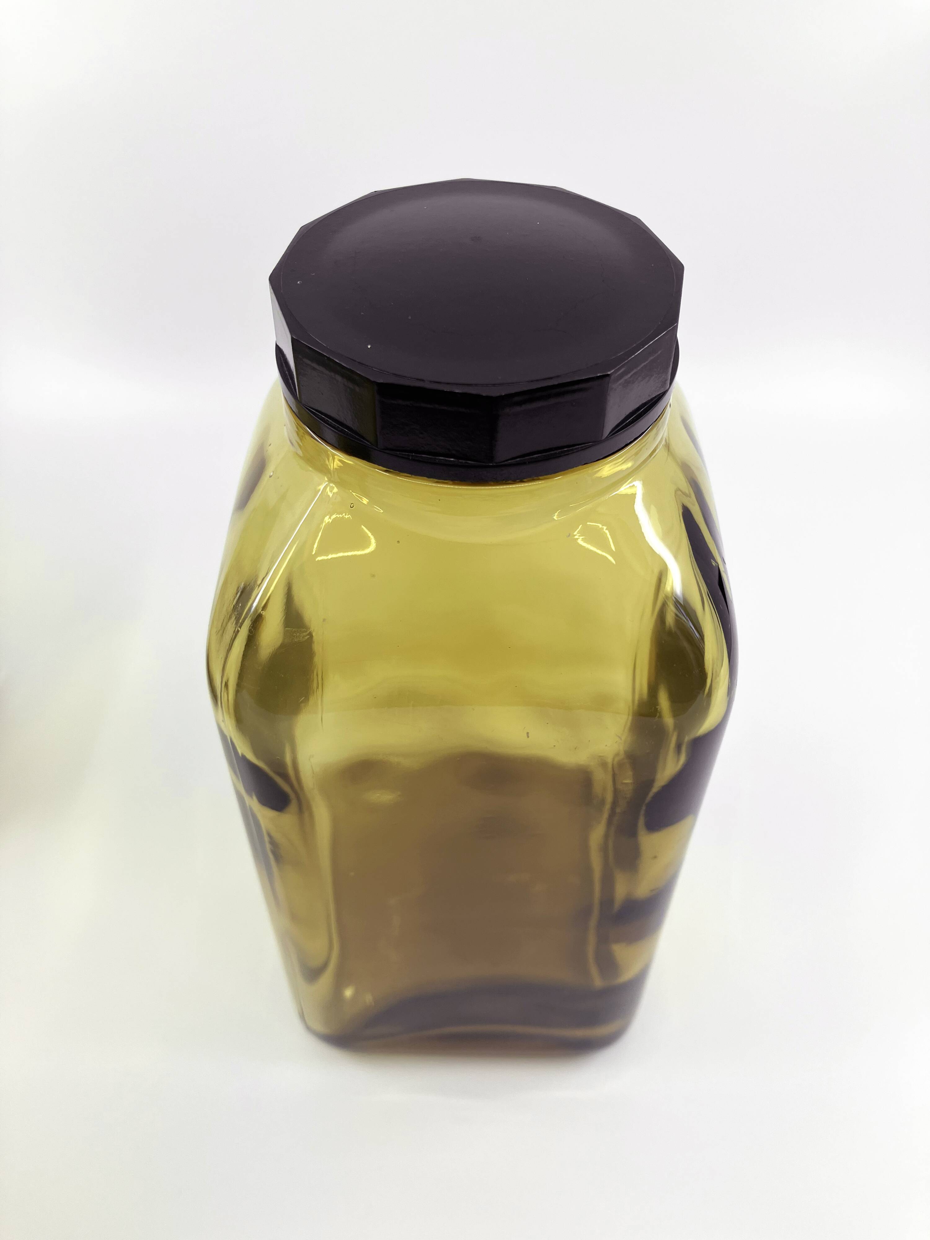 3 molded amber glass pharmacy bottles • Bakelite stoppers • 1950