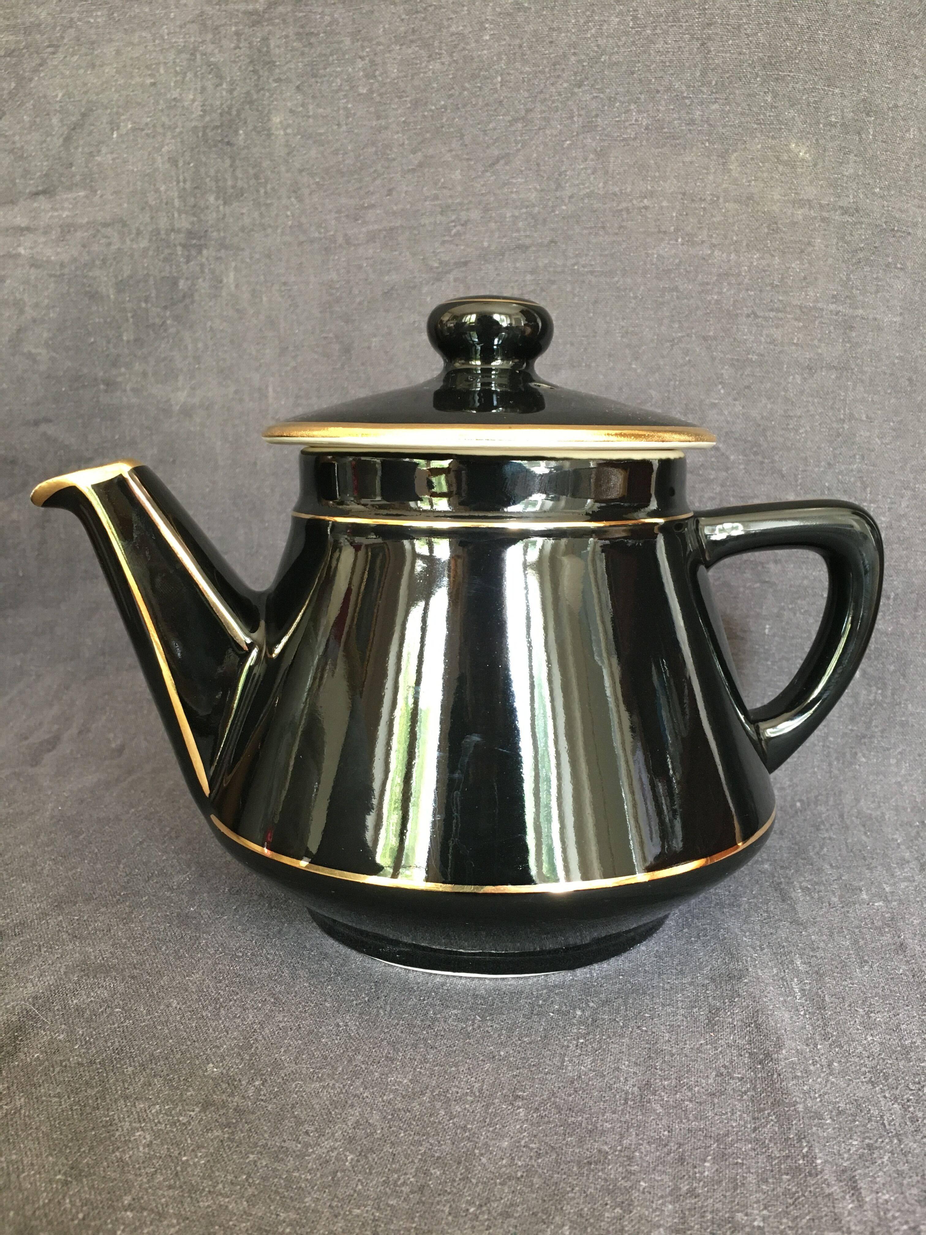 Black and gold ceramic coffee maker