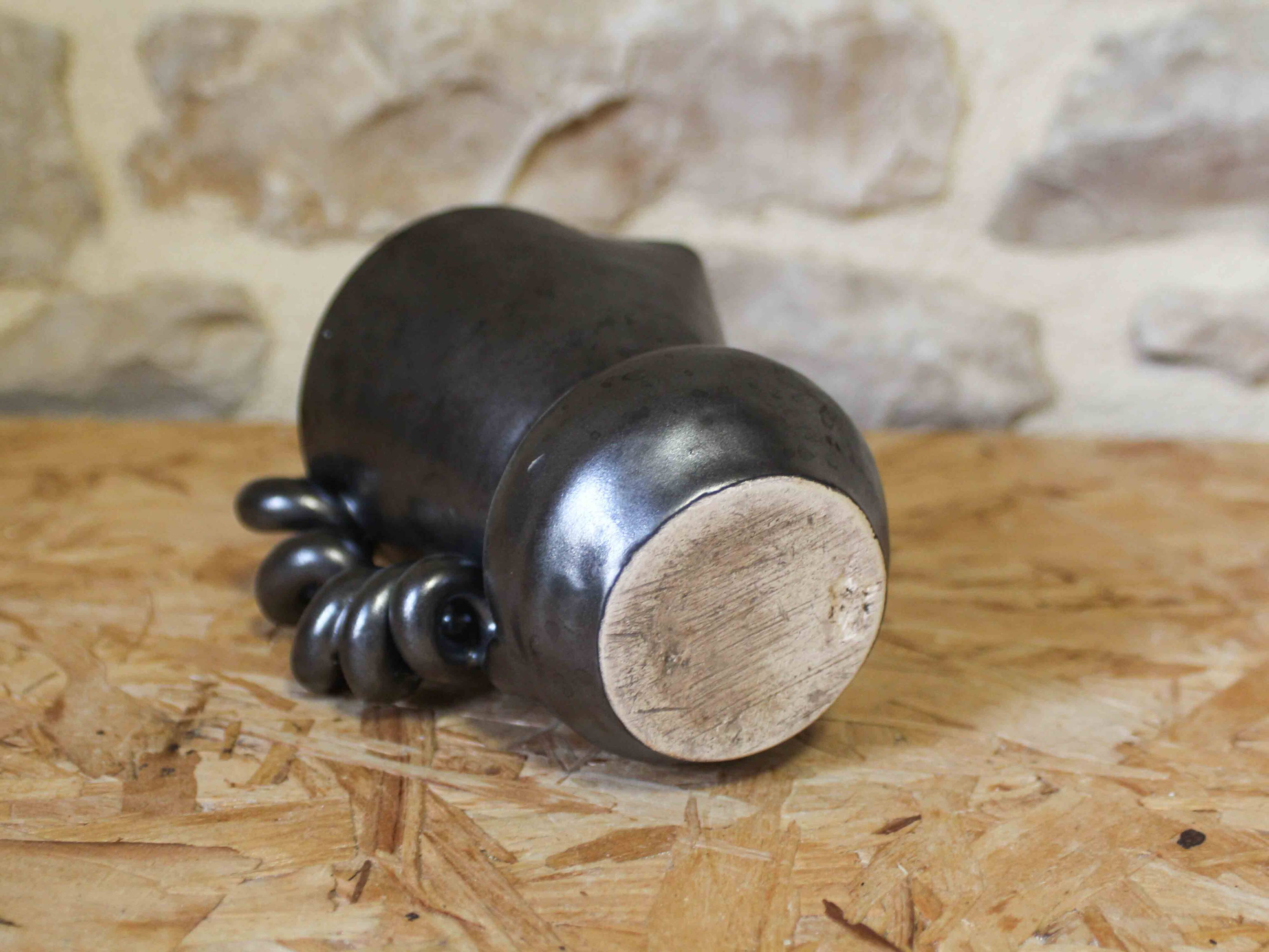 Ceramic jug with a twisted handle