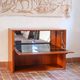 Vintage teak bar cabinet with black glass interior.