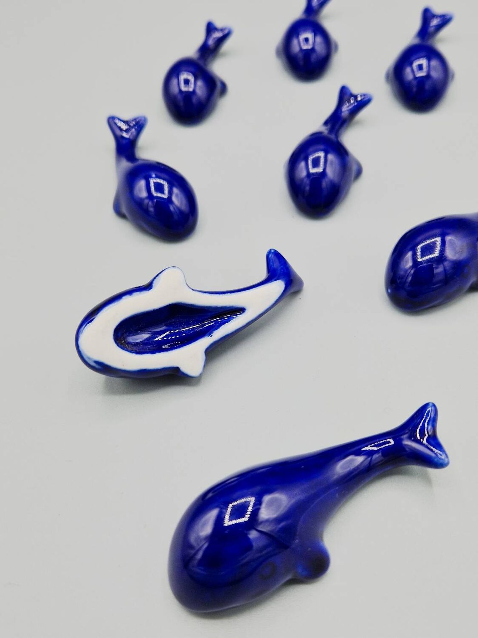 Set of 6 vintage blue porcelain whale knife rests.