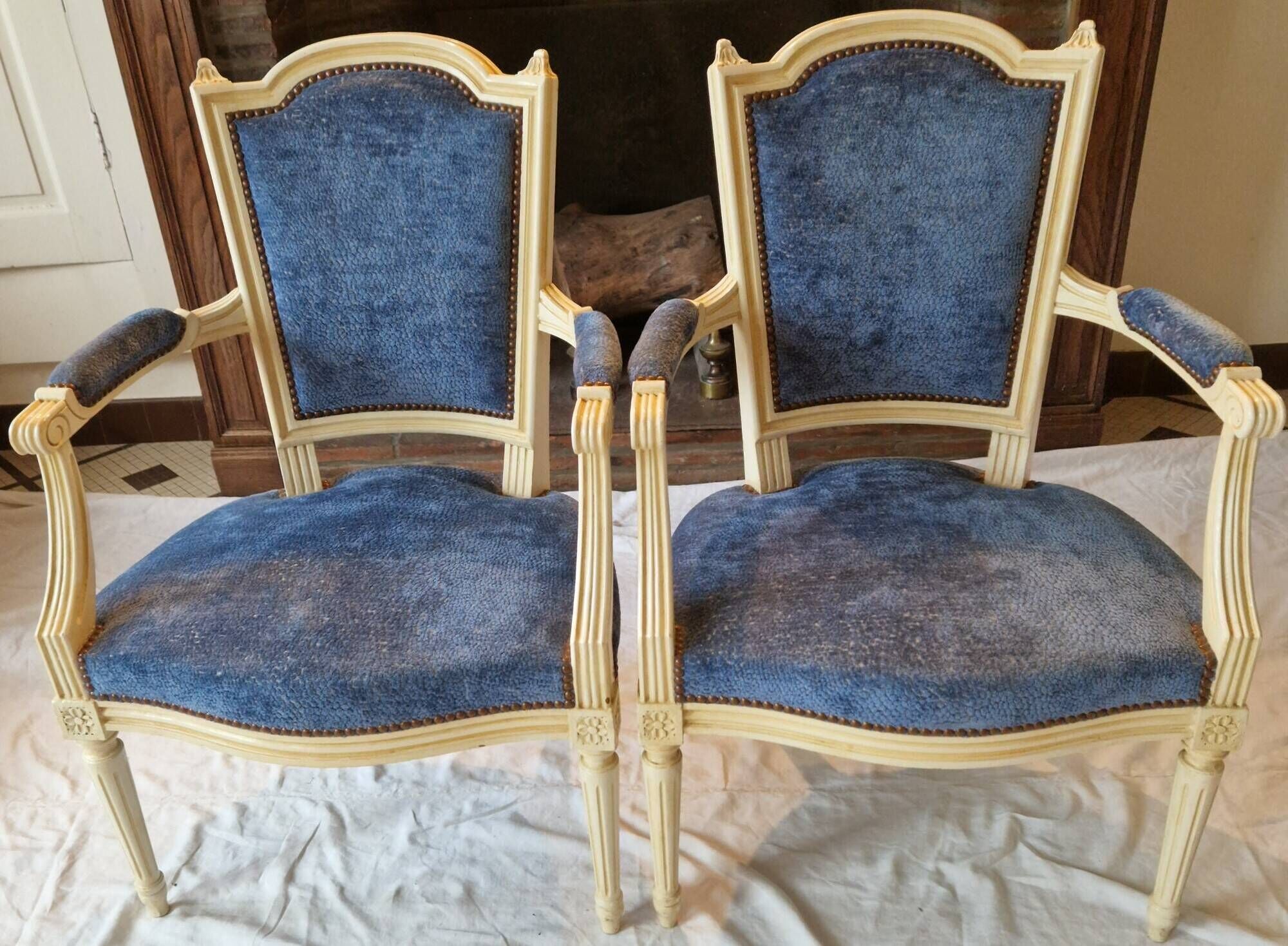 Pair of Louis XVI cabriolet armchairs in cream and blue French elegance late 19th century