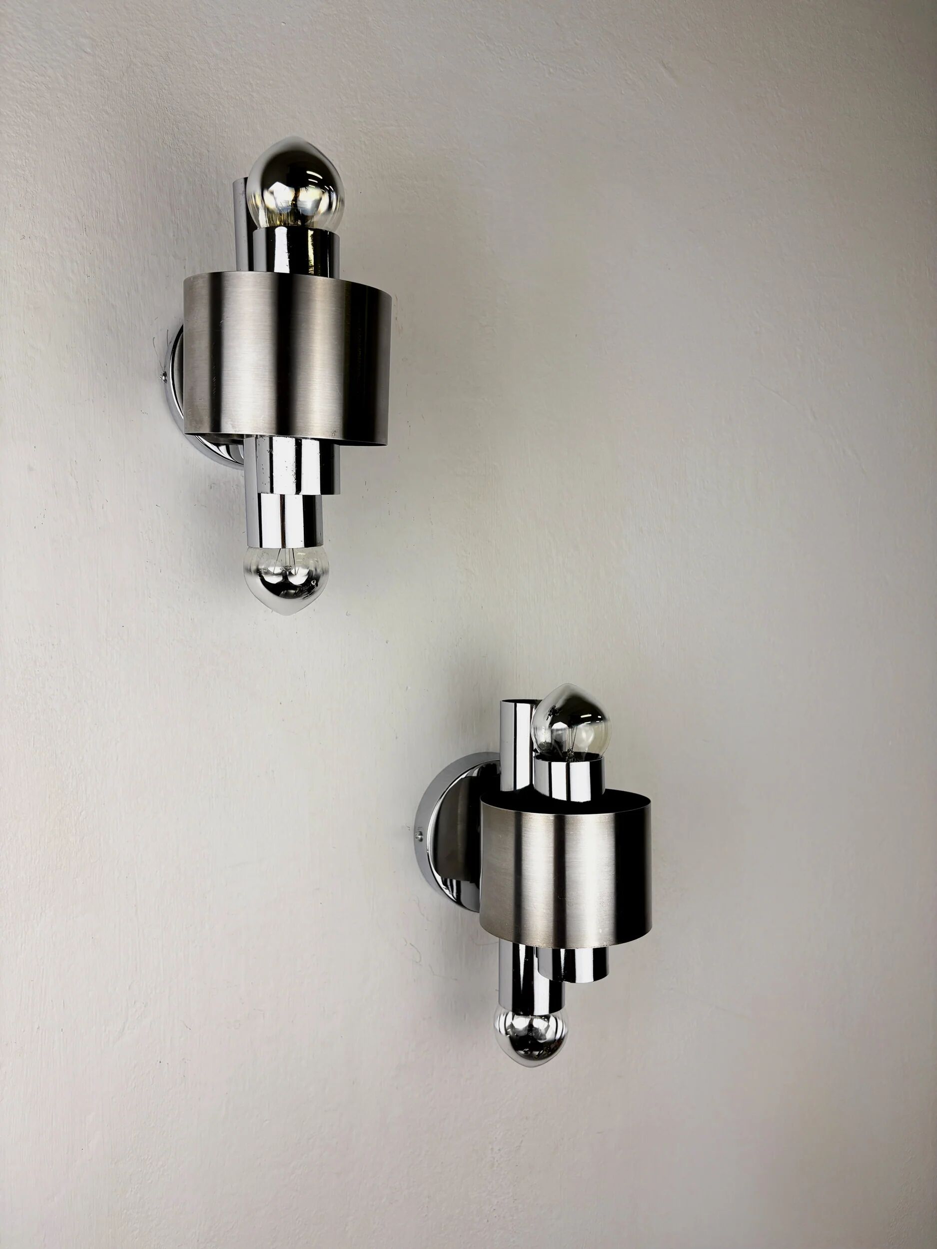 Pair of space age 2-light wall sconces, chromed metal, Italy, 1970s